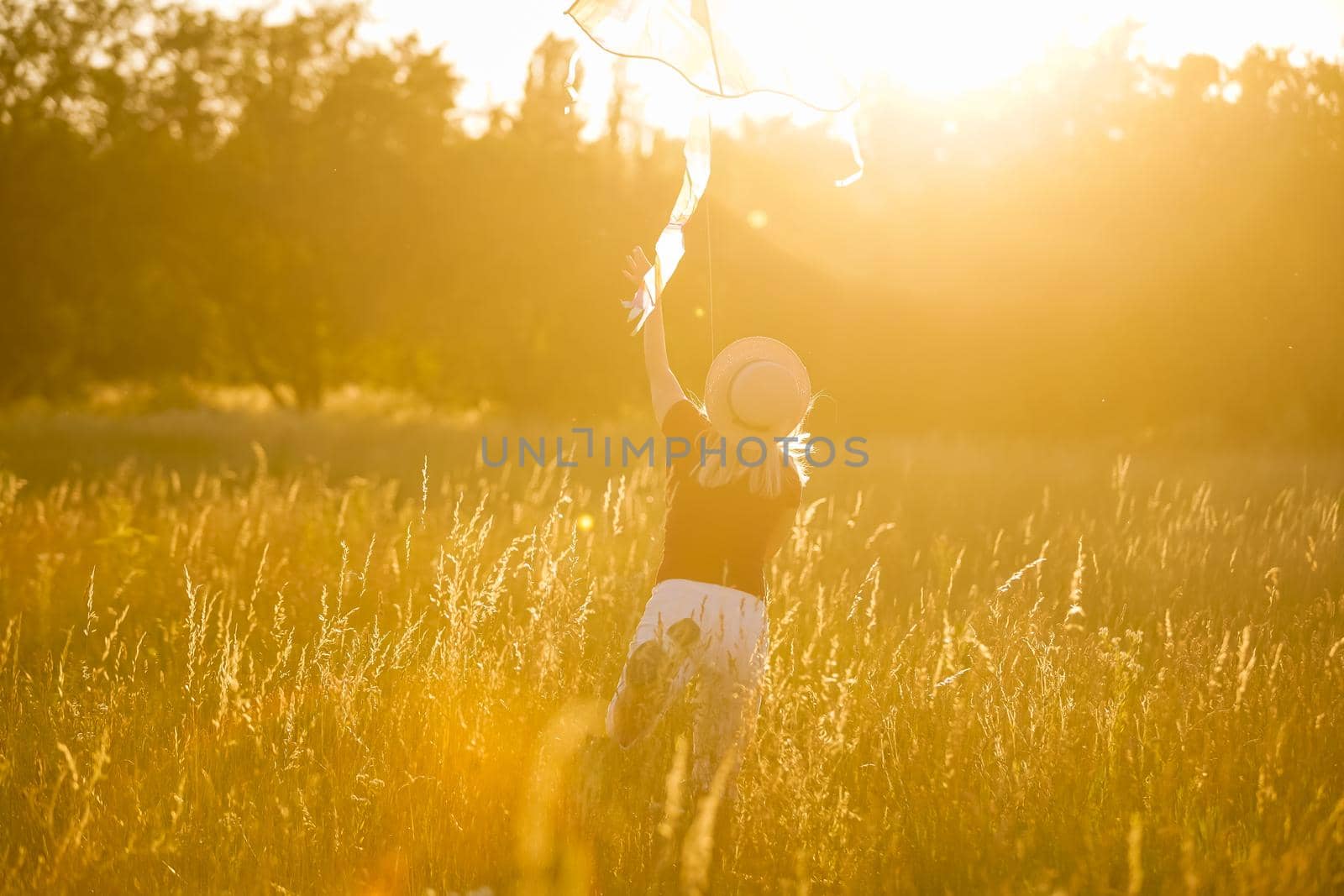 woman with a kite in the field