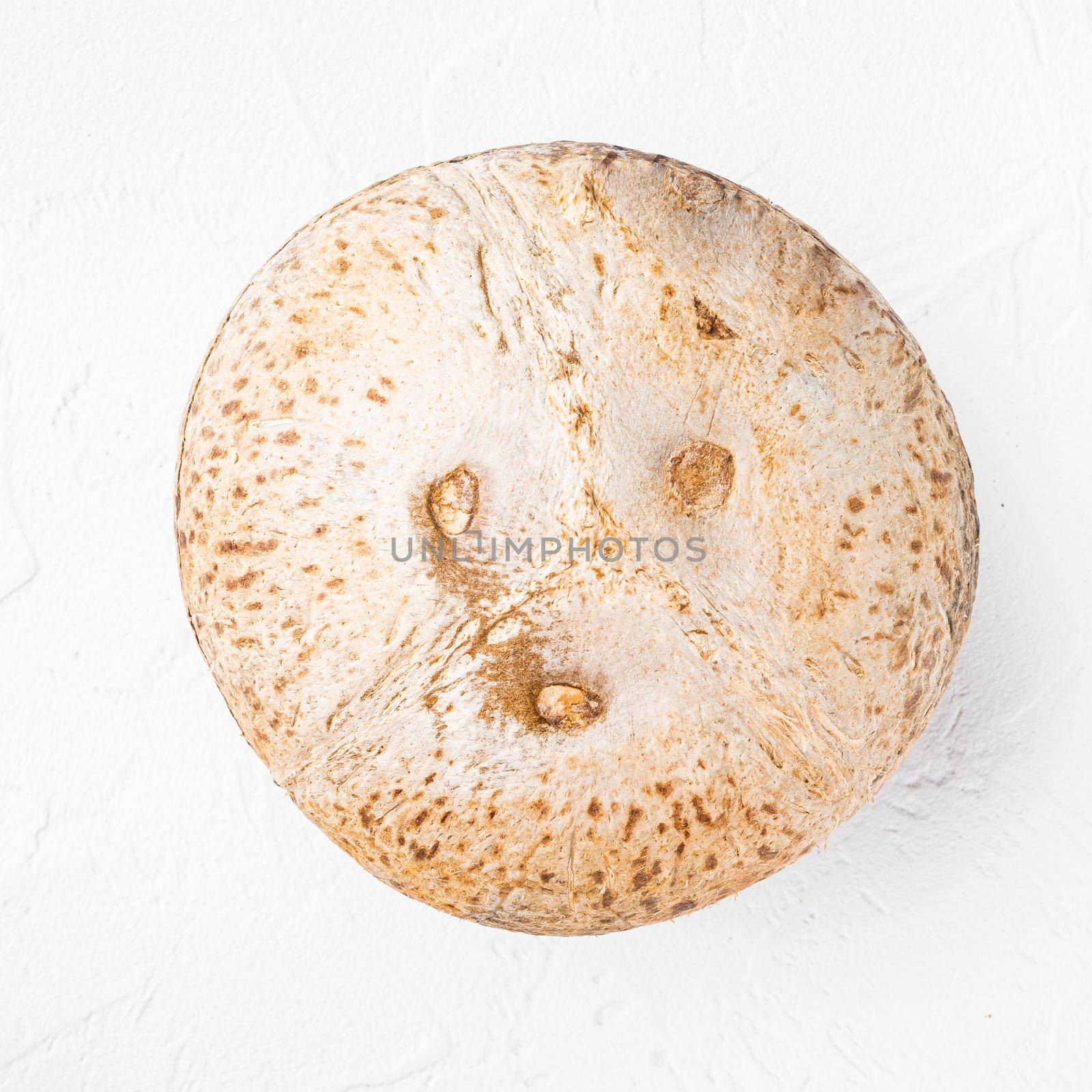 Whole ripe fresh Coconut, on white stone table background, top view flat lay by Ilianesolenyi