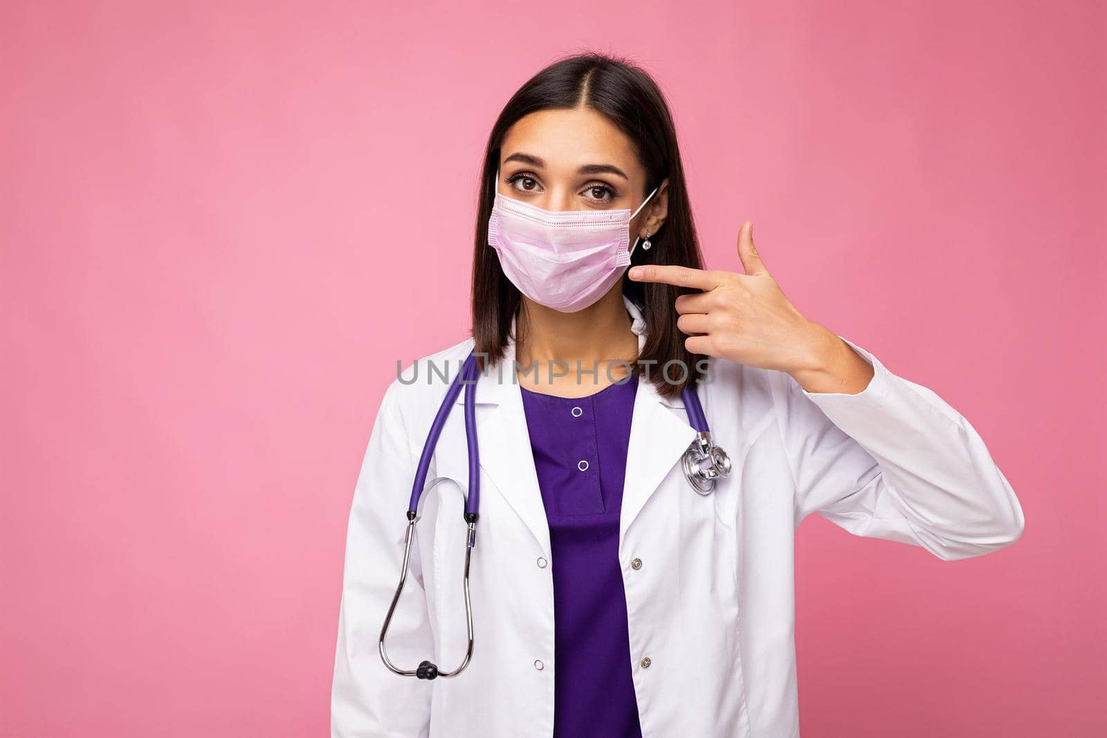 Covid19, coronavirus, healthcare and doctors concept. Photo of professional confident young european doctor in medical mask and white coat, stethoscope over neck, ready help patient, fight disease.