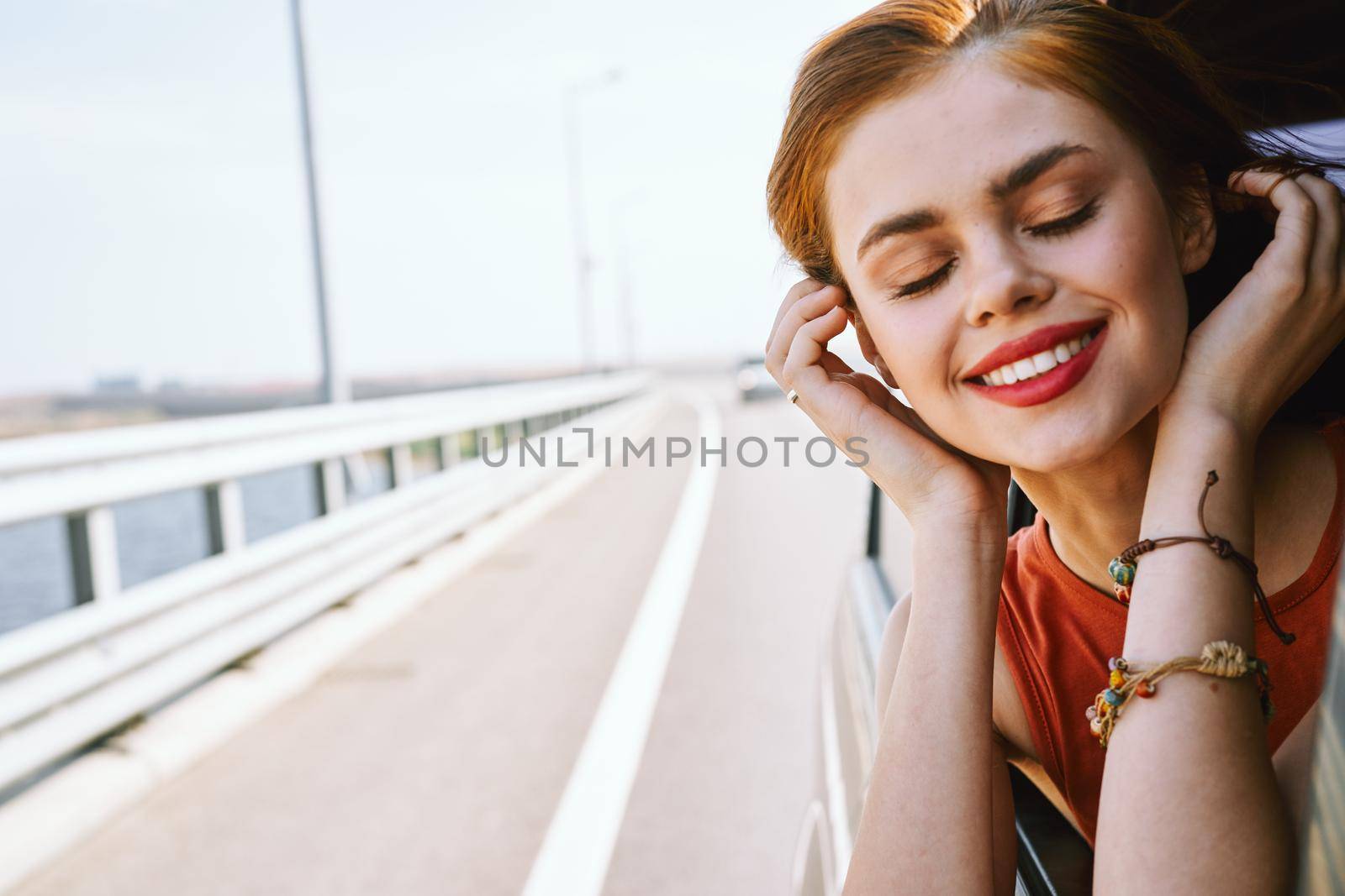 cheerful woman car ride road travel adventure by Vichizh