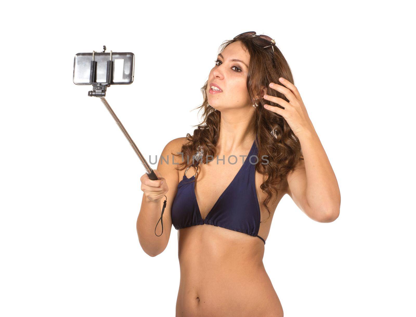 Woman in swimsuits taking a selfie. by gsdonlin