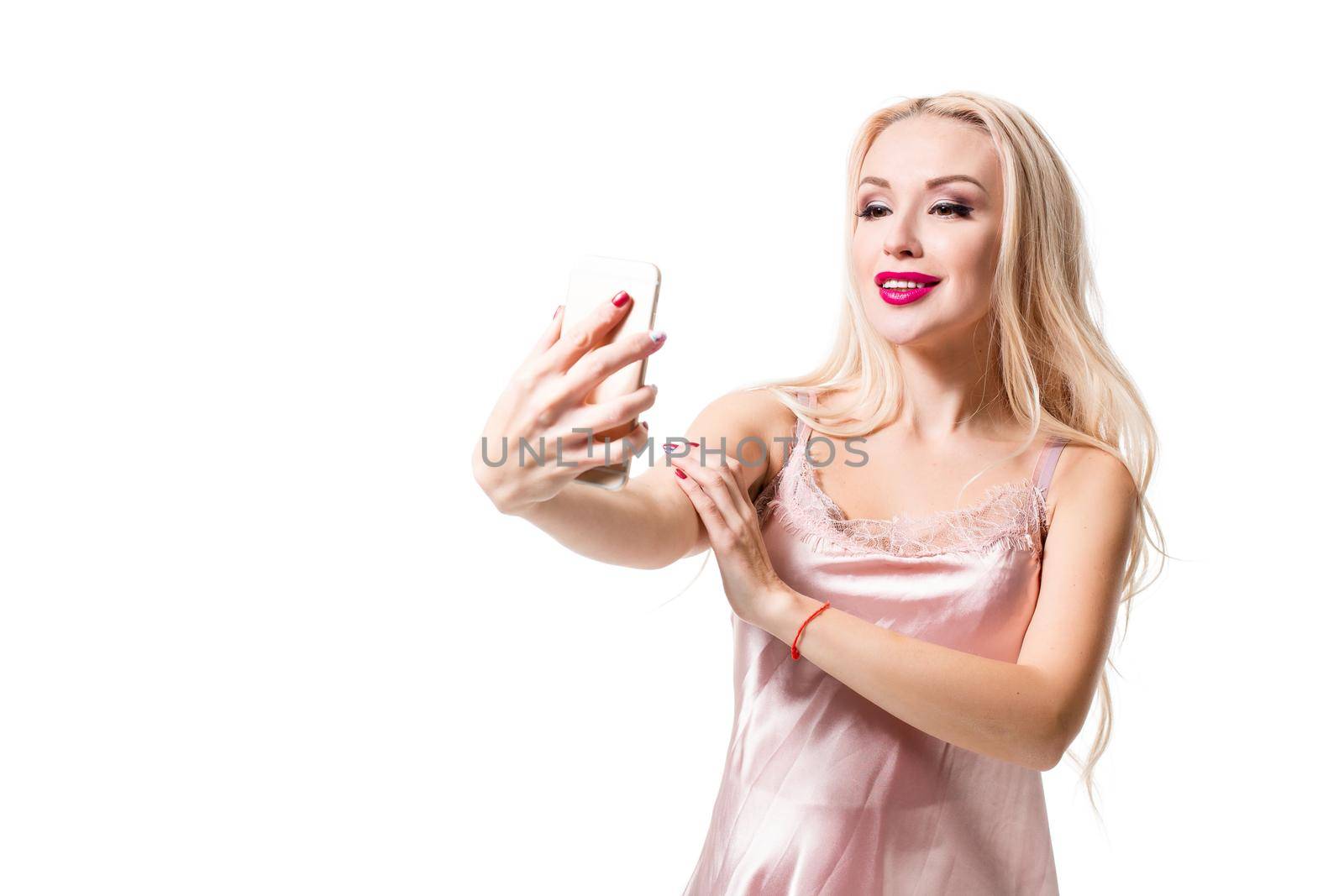 blonde doing selfie on isolated white background by nazarovsergey
