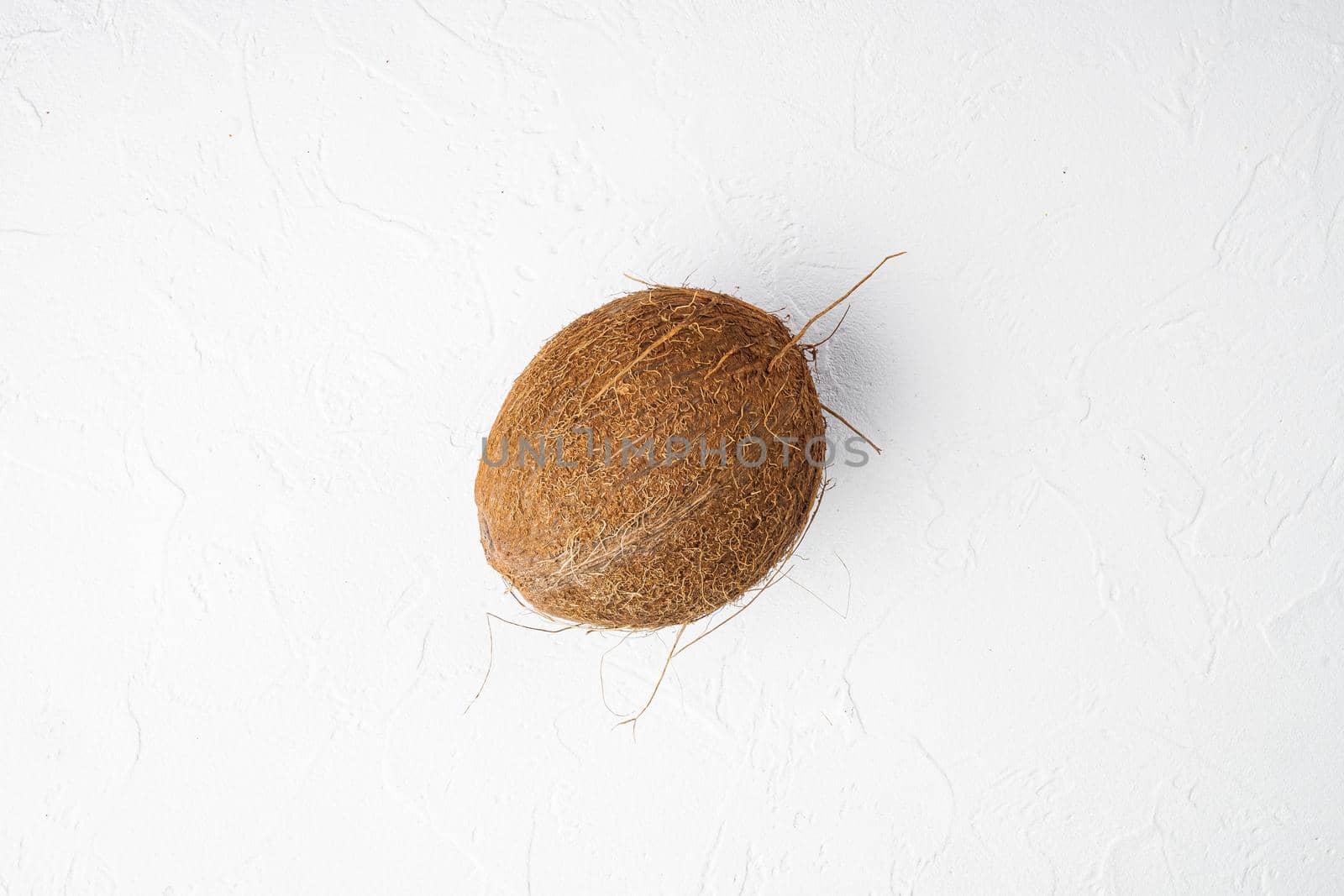Coconut whole set, on white stone table background, top view flat lay, with copy space for text