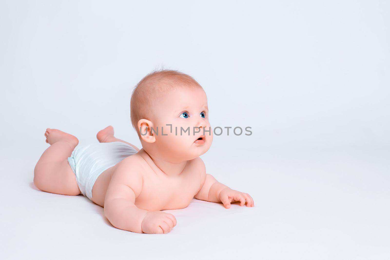 Cute baby girl on white background. Baby in diaper