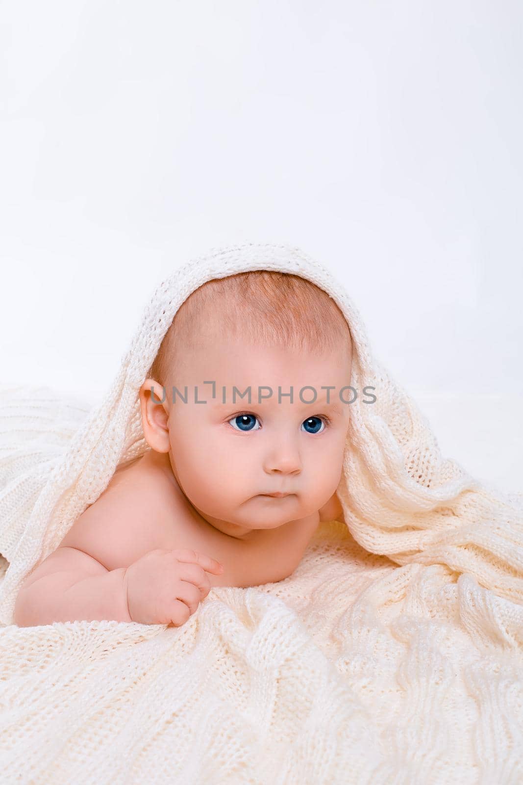 Cute baby girl on white background with isolation. Baby with a towel on his head