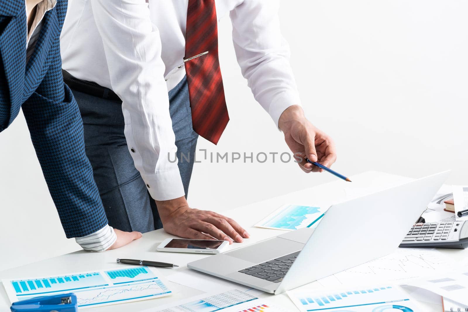 Corporate teamwork concept with business people. Idea presentation and strategy planning. Office desk with financial documents. Investment project analysis and discussion. Business meeting in office