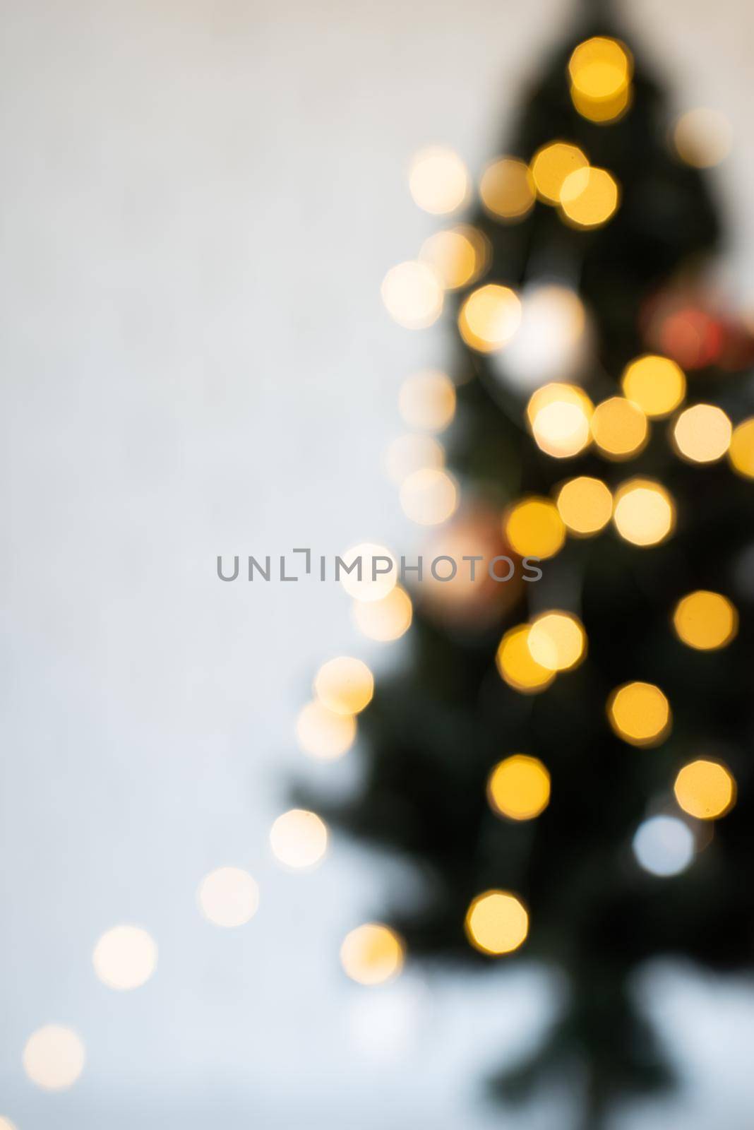 Merry Christmas background. blurred christmas tree with fairy lights