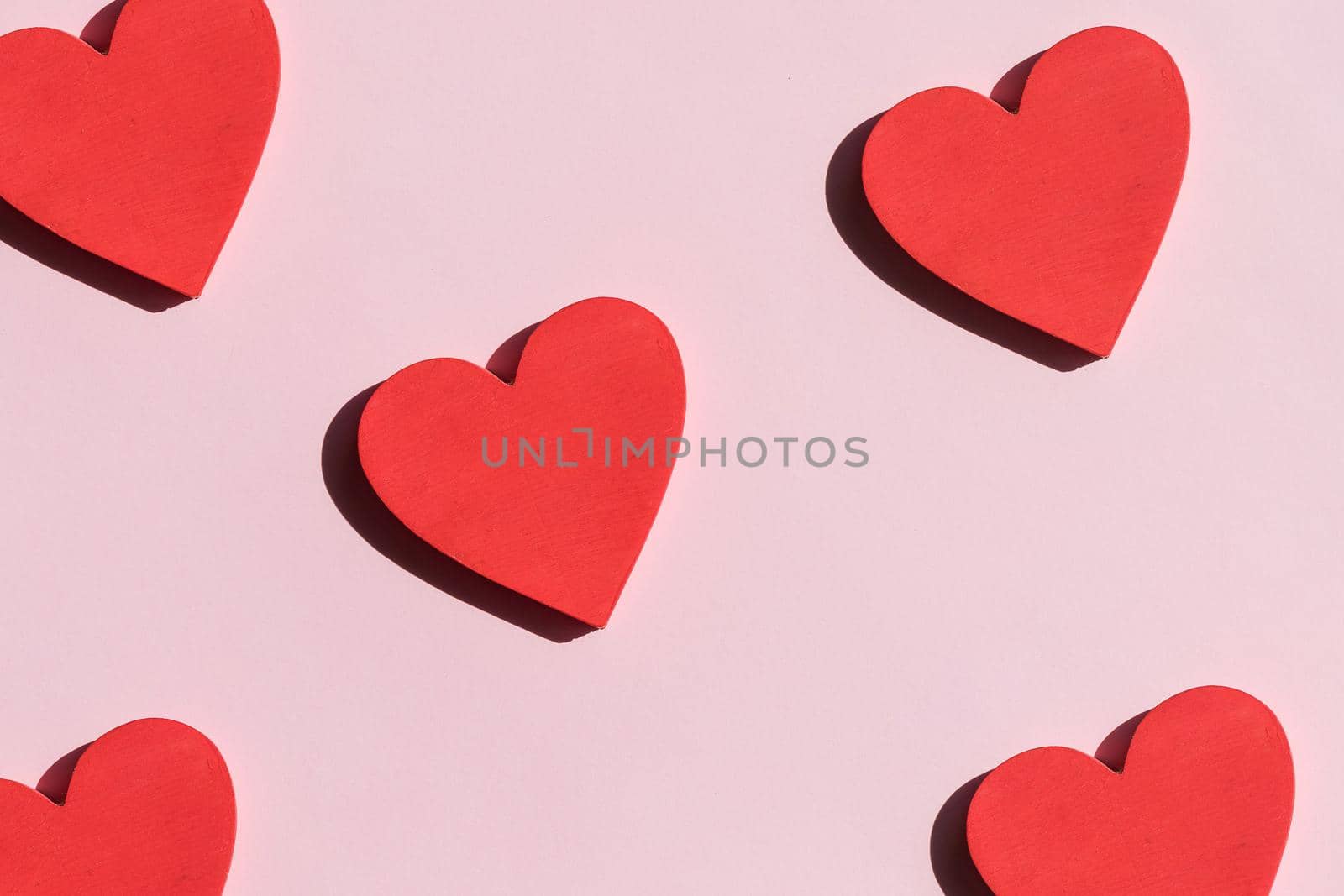Red hearts on white background. Top view. Valentine's Day. Symbol of love.