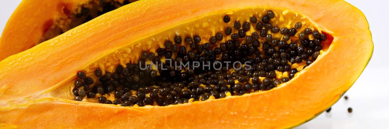 papaya isolate on white. delicious ripe papaya cut in half close-up by PhotoTime