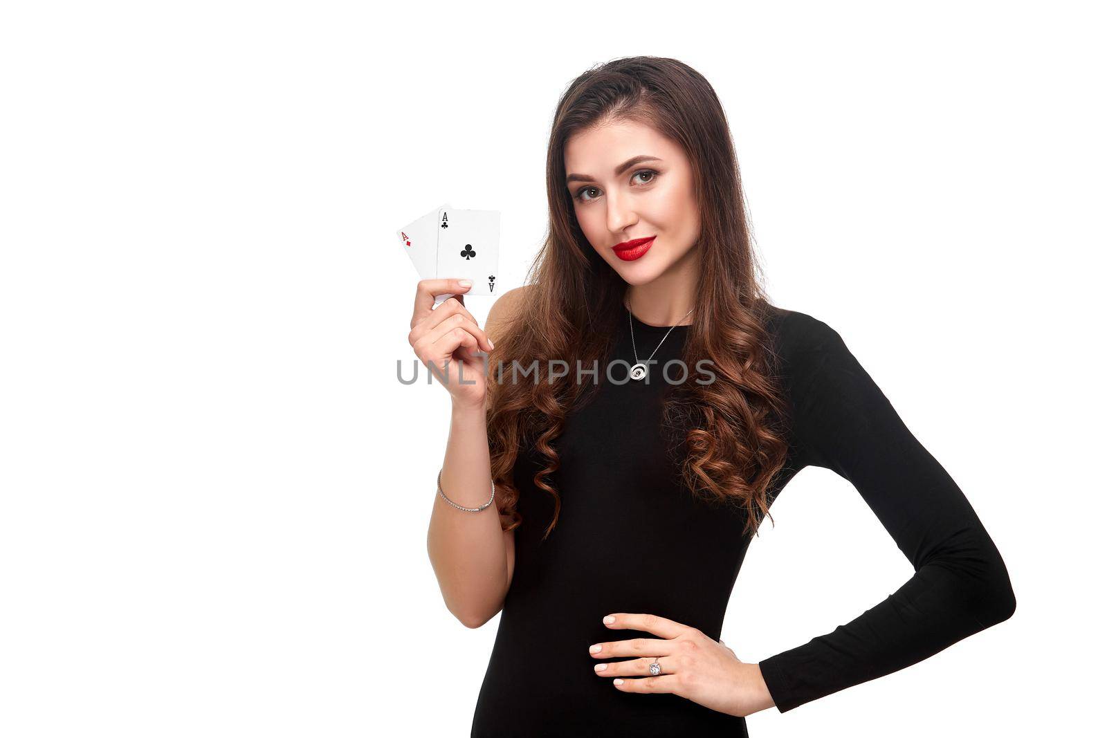 Sexy curly hair brunette posing with two aces cards in her hands, poker concept isolation on white background by nazarovsergey