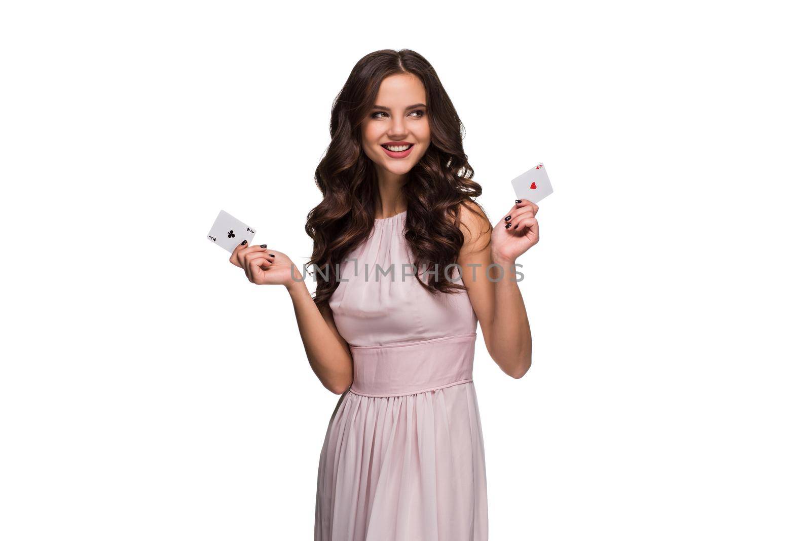 Beautiful confident woman showing poker cards looking at camera with copy place by nazarovsergey