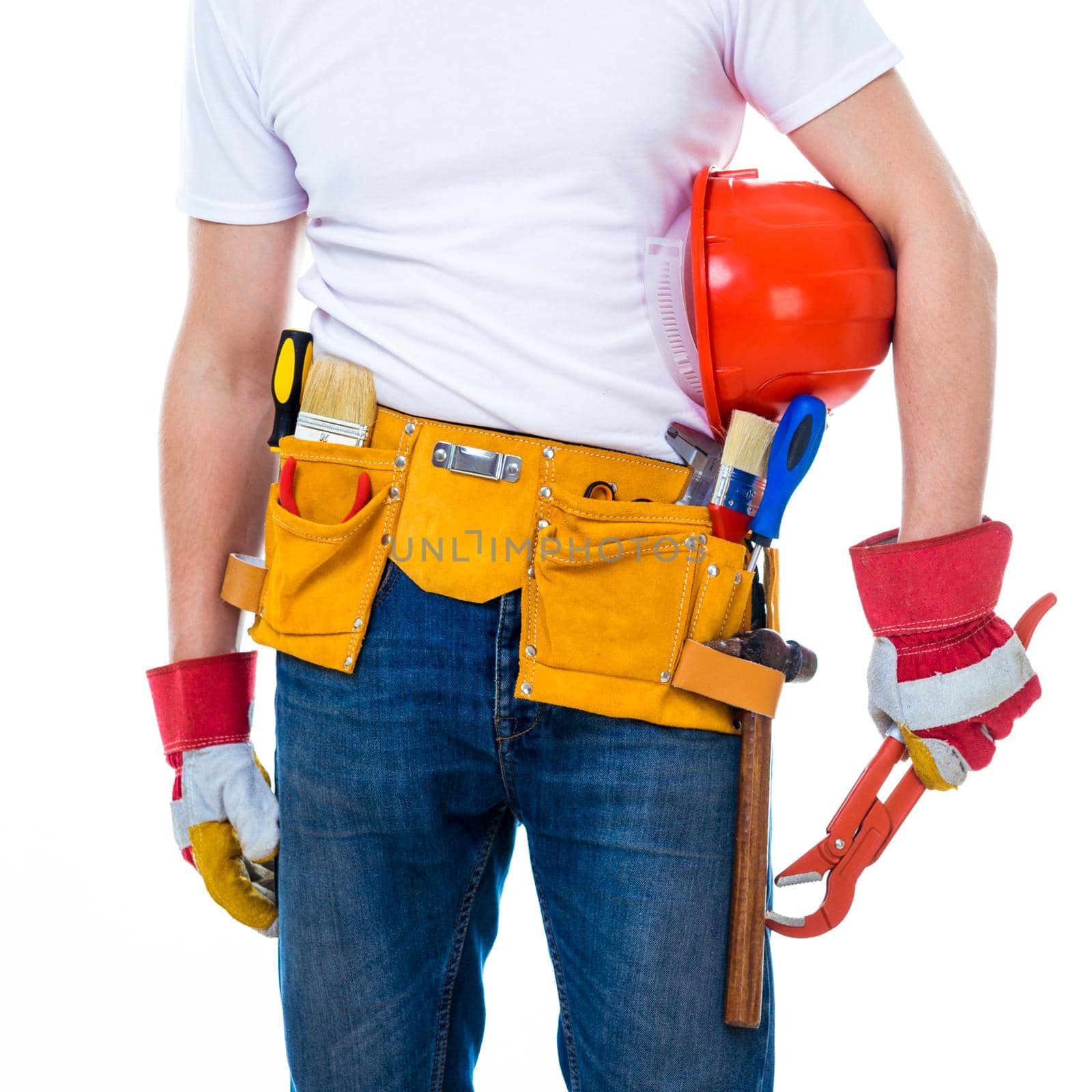 worker with tools belt holding an adjustable wrench