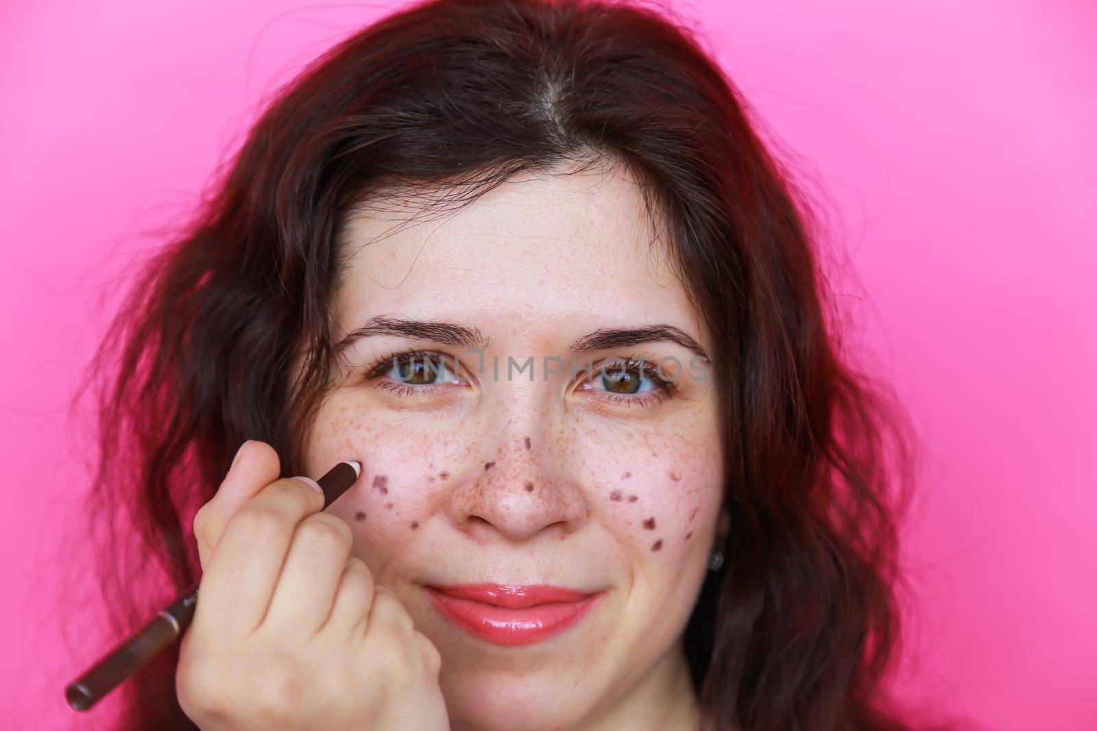 Portrait of bright beautiful girl with art colorful freckles make-up. Body positivity.
