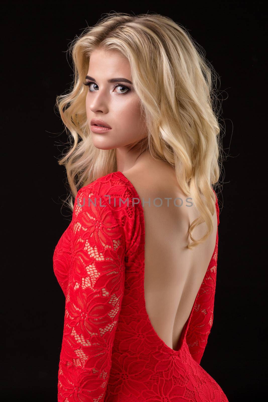 Beautiful sexy blonde woman on black background, party. by nazarovsergey