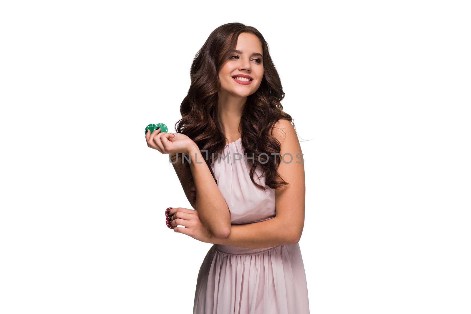 Sexy curly hair brunette posing with chips in her hands, poker concept isolation on white background by nazarovsergey