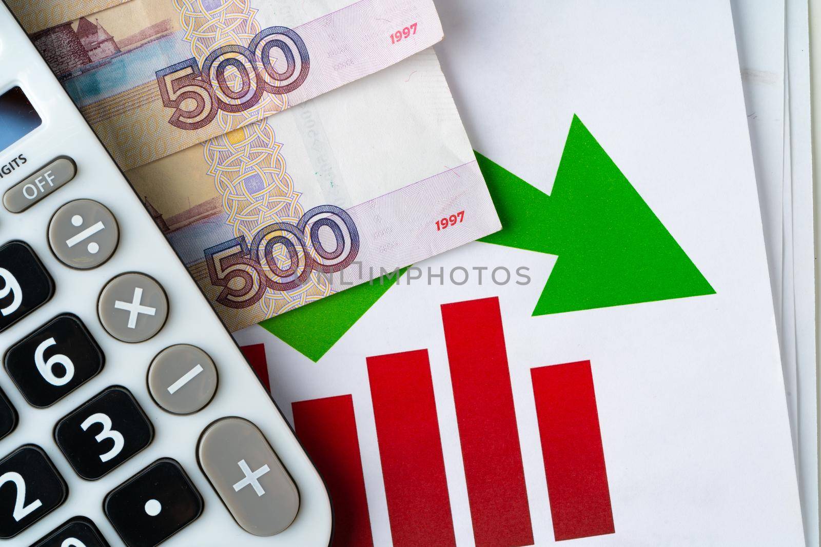 Financial chart with Russian rubles money stack with calculator. Currency appreciation concept. High quality photo