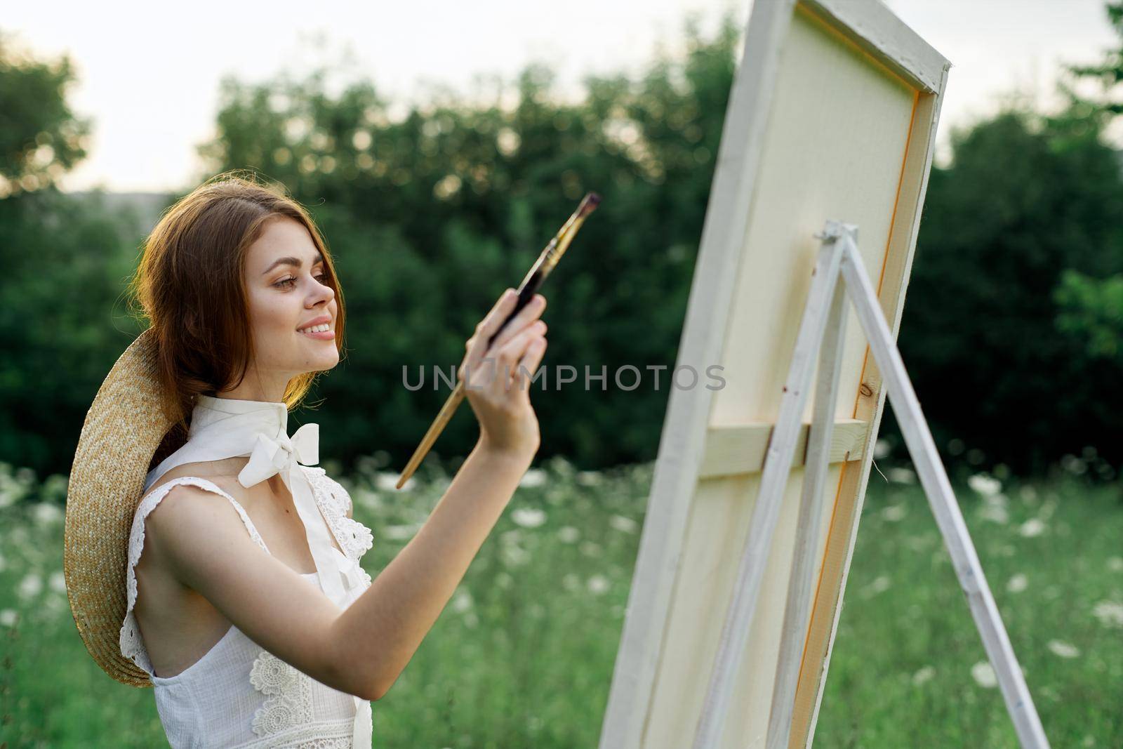 woman artist outdoors painting nature hobby art by Vichizh