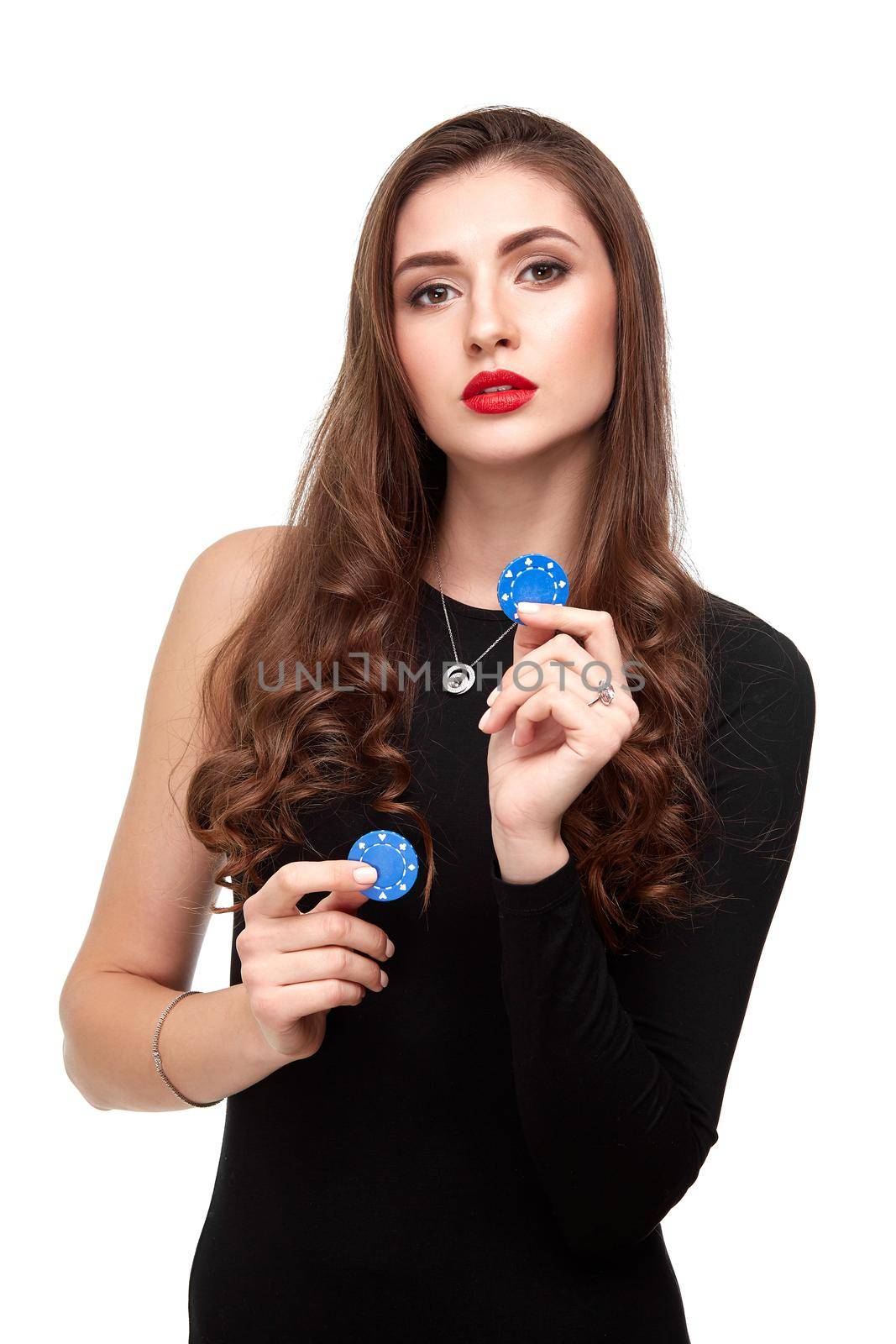 Sexy curly hair brunette in black dress posing with chips in her hands, poker concept isolation on white background Casino, poker, Roulette Blackjack Spin.