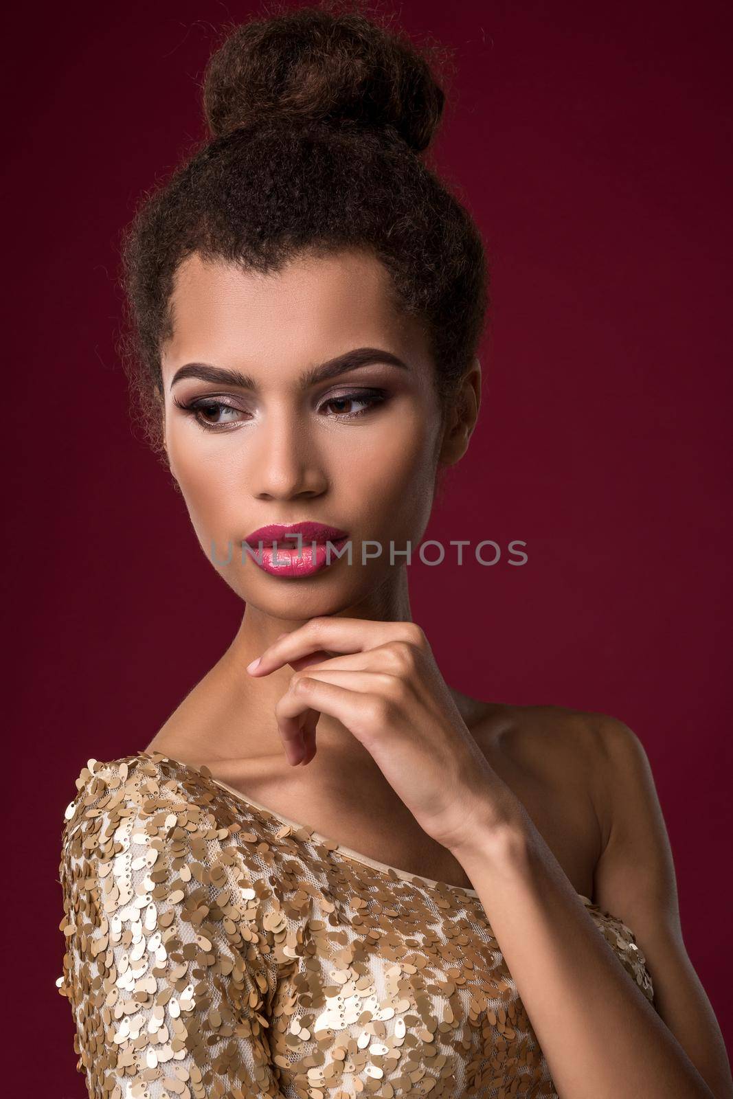 Fashion young African woman with make-up, in sexy gold dress. by nazarovsergey