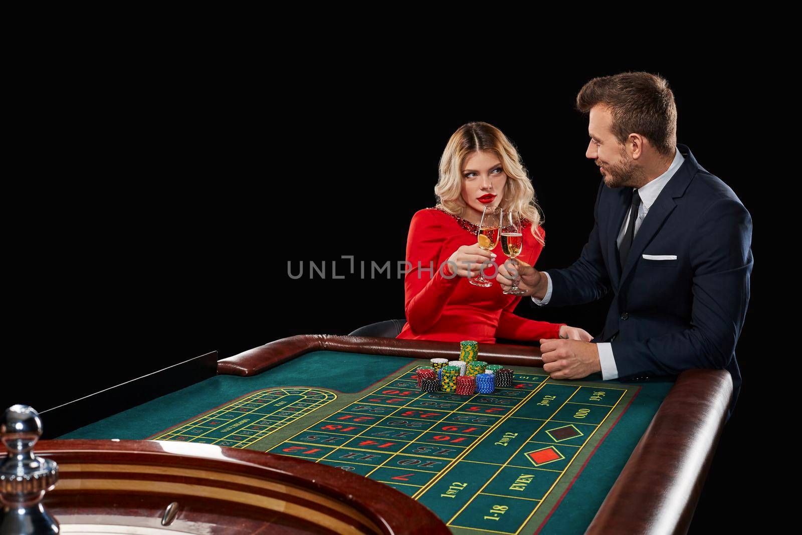 Couple playing roulette wins at the casino. by nazarovsergey