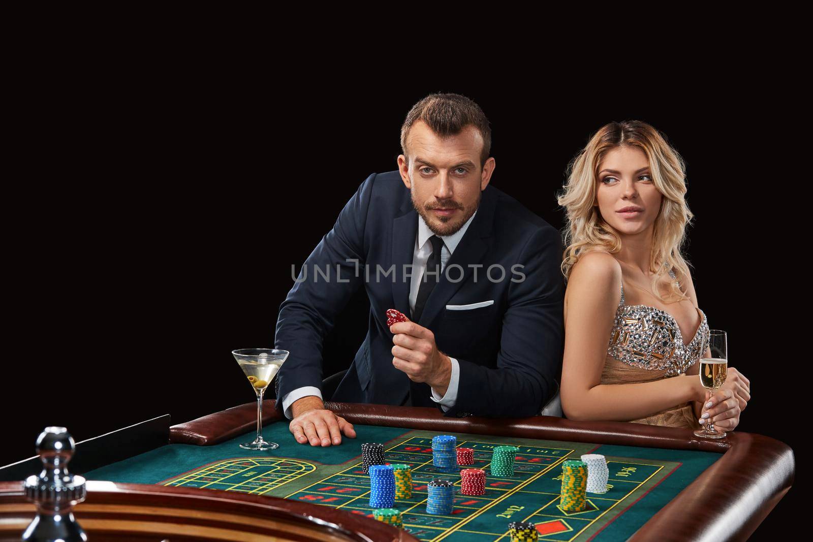 Couple playing roulette wins at the casino. Addiction to the gambling