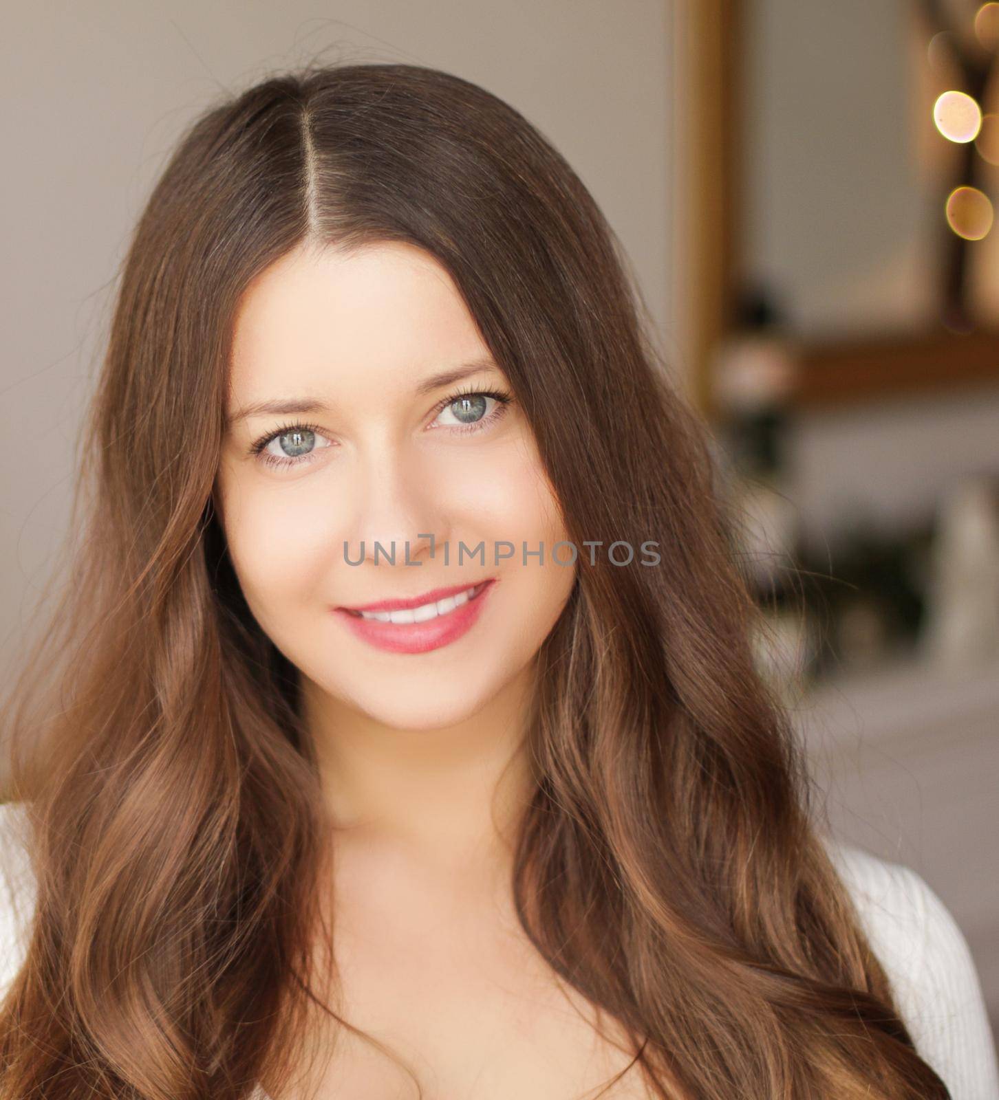 Christmas time and holiday mood concept. Happy smiling woman and decorated xmas tree lights on background by Anneleven