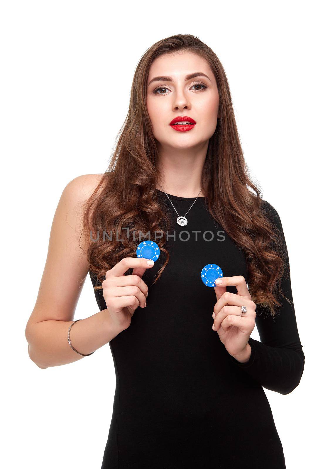 Sexy curly hair brunette in black dress posing with chips in her hands, poker concept isolation on white background Casino, poker, Roulette Blackjack Spin.