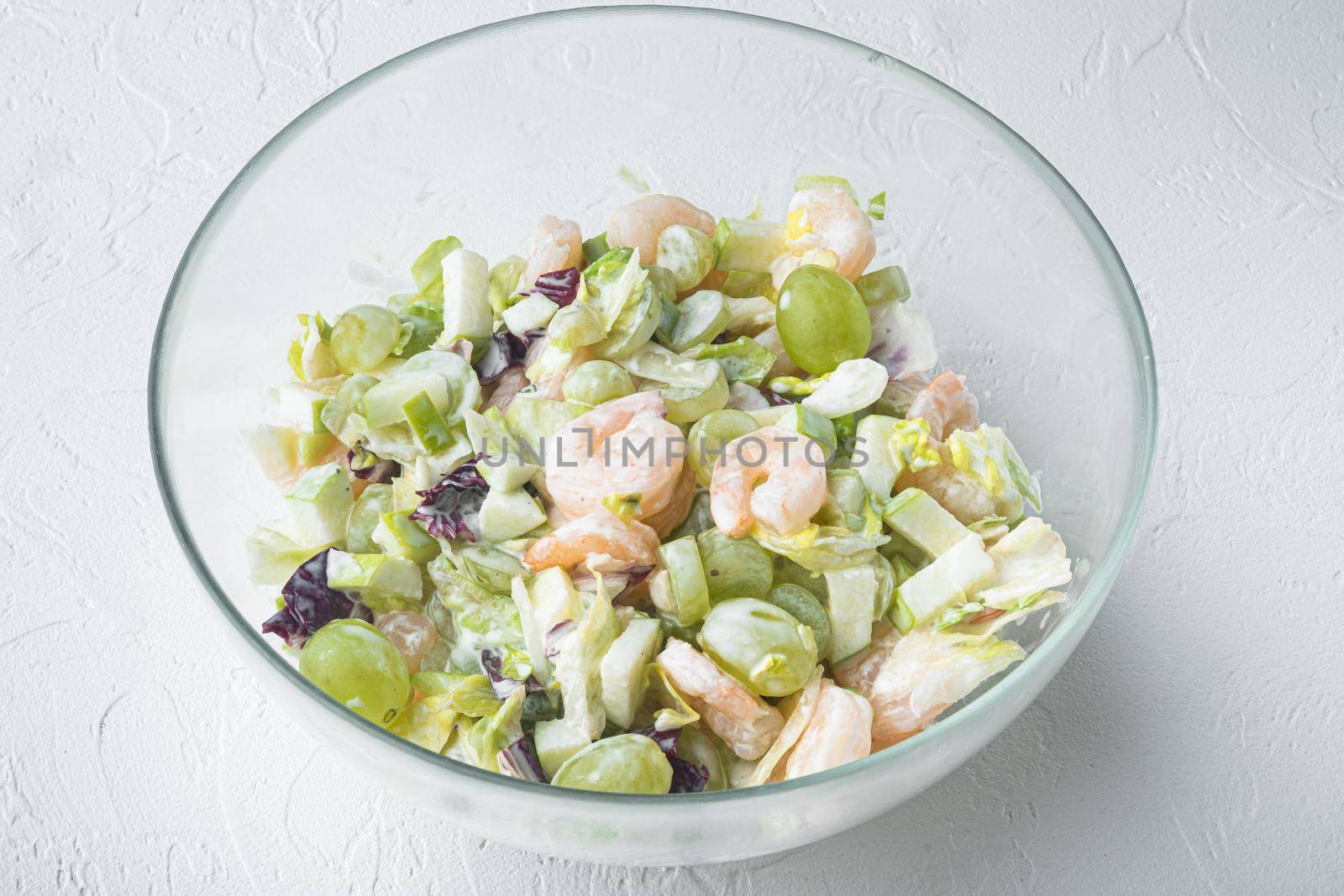 Prawn cocktail with lettuce, cherry tomatoes, dressing, dill set , with sauce apple and grape, on white background