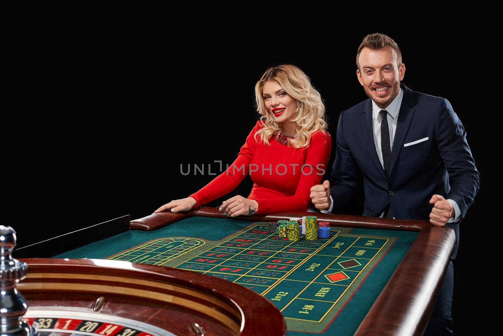 Couple playing roulette wins at the casino. by nazarovsergey