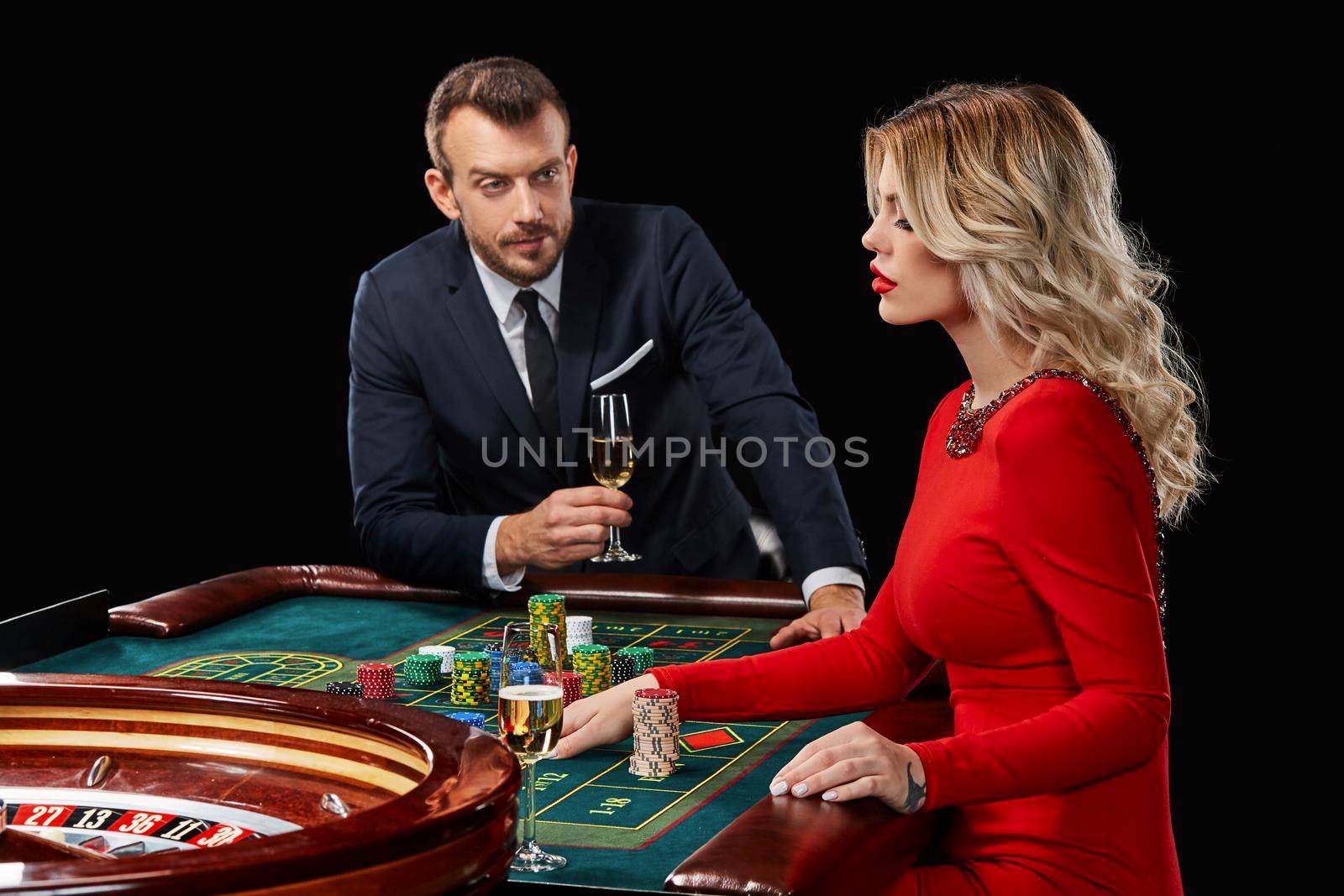 Couple playing roulette wins at the casino. by nazarovsergey
