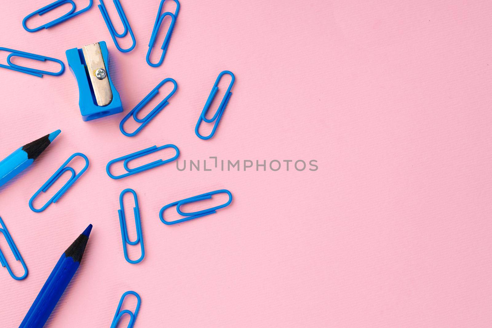 Back to school. Scattered stationery on paper background top view