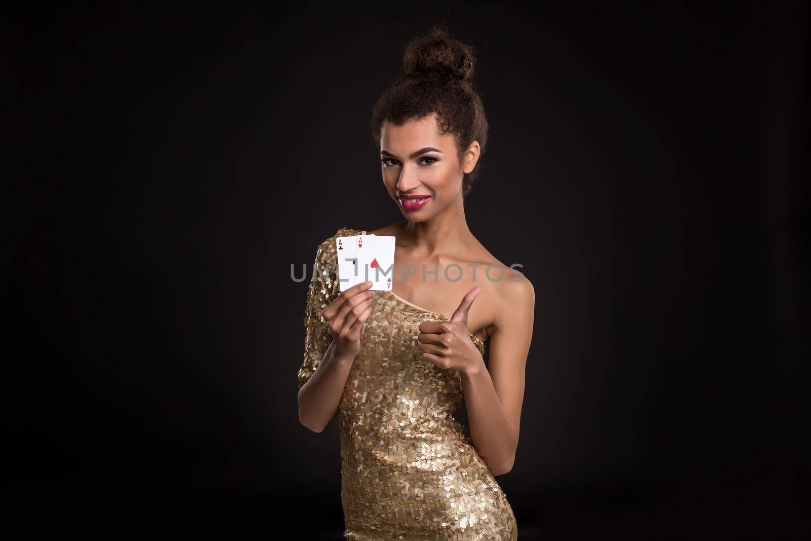 Pretty african girl shows two aces in casino poker and win by nazarovsergey