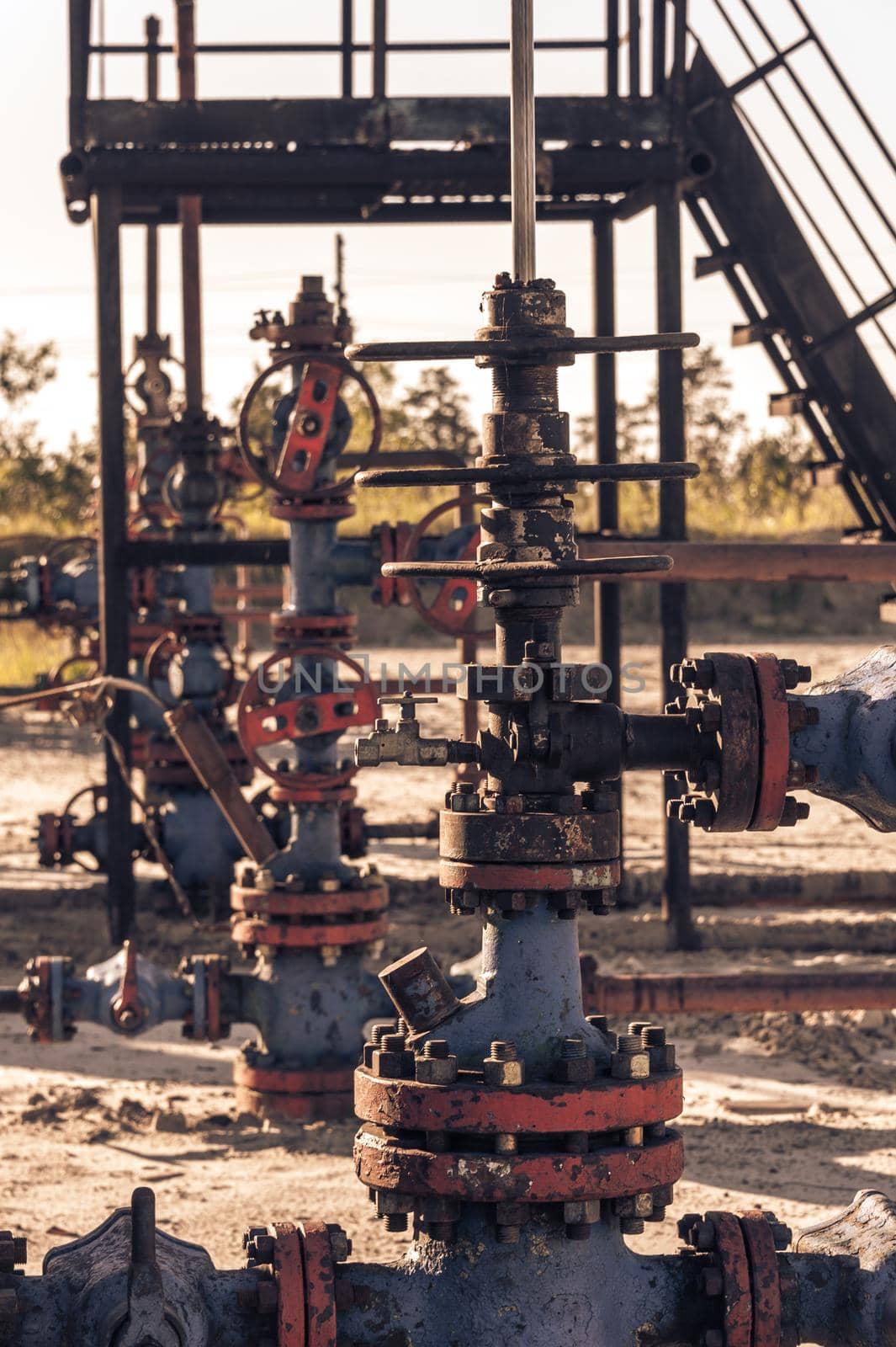Valves armature of an oil well mouth. Oil and gas industry theme. Petroleum concept. Russia, Sibirea.