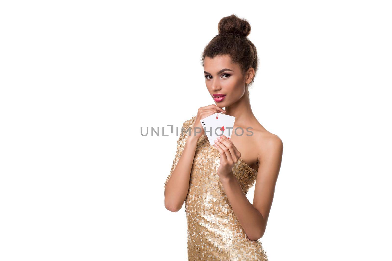 Beautiful young woman holding two ace of cards in her hand isolated on white. Studio shot. Poker