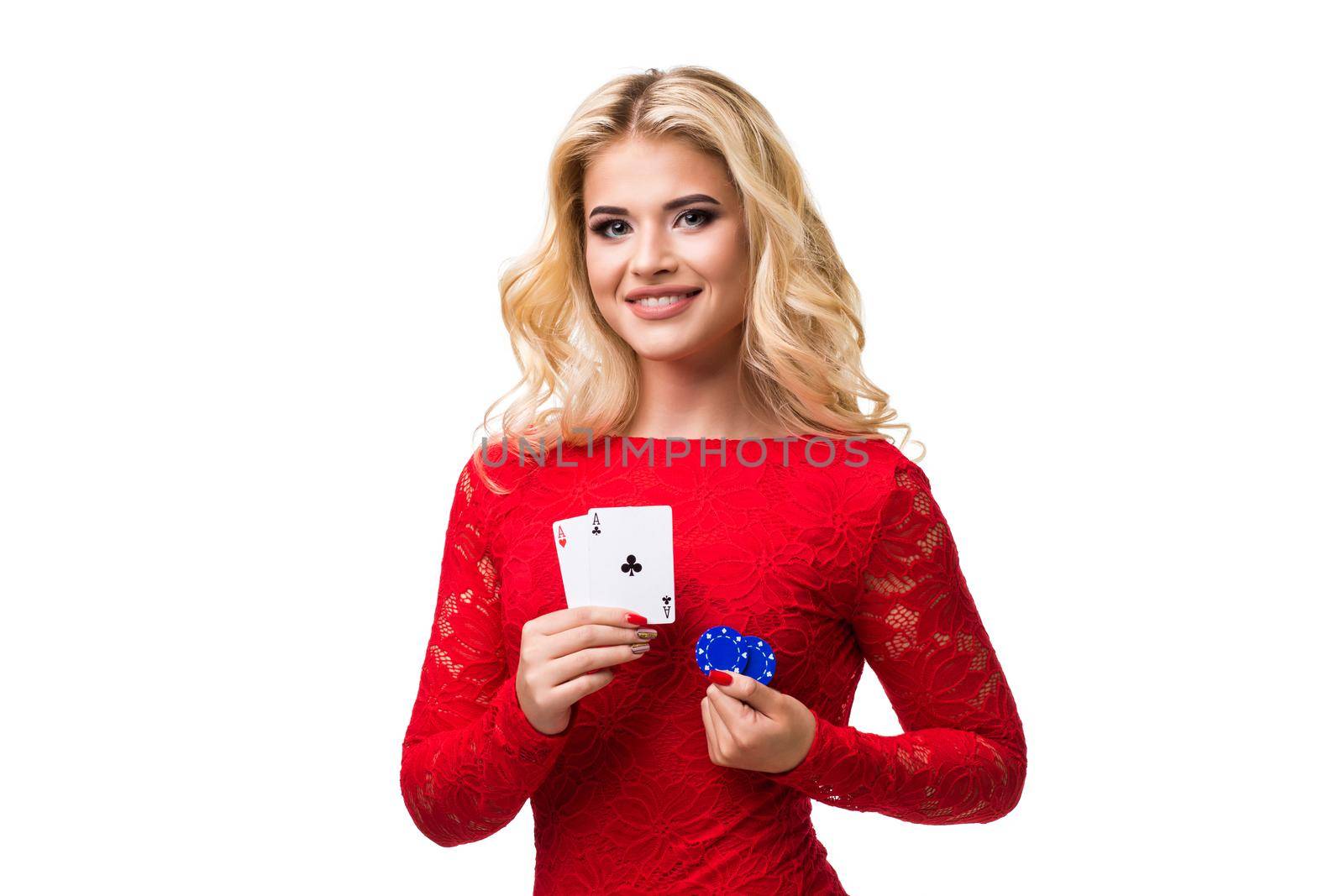 Caucasian young woman with long light blonde hair in evening outfit holding playing cards and chips. Isolated. Poker by nazarovsergey