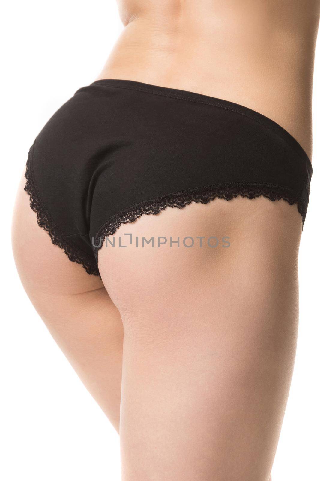 girl in black lace panties, back view, half-length shot on a white background by TRMK