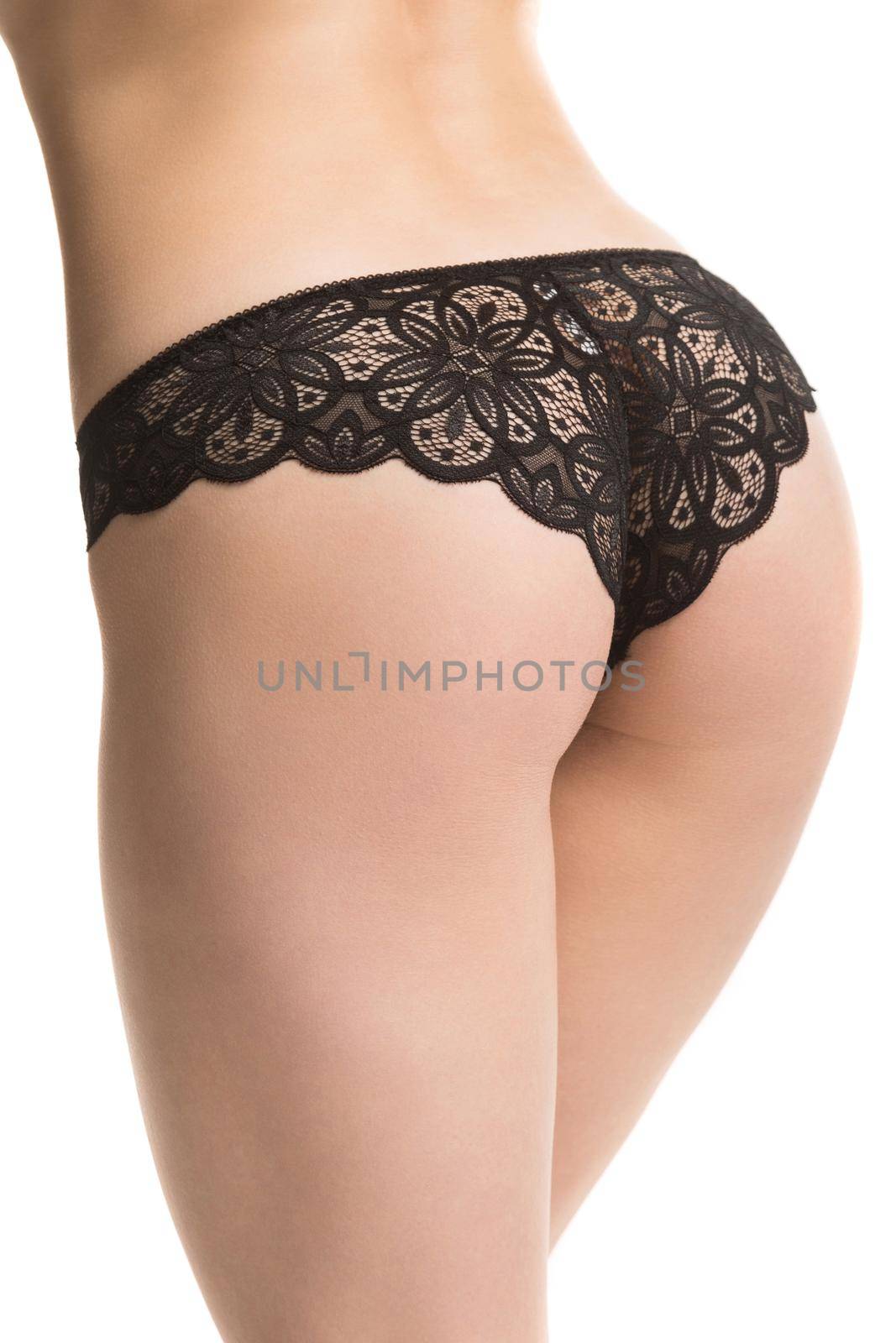 girl in black lace panties, back view, half-length shot on a white background by TRMK