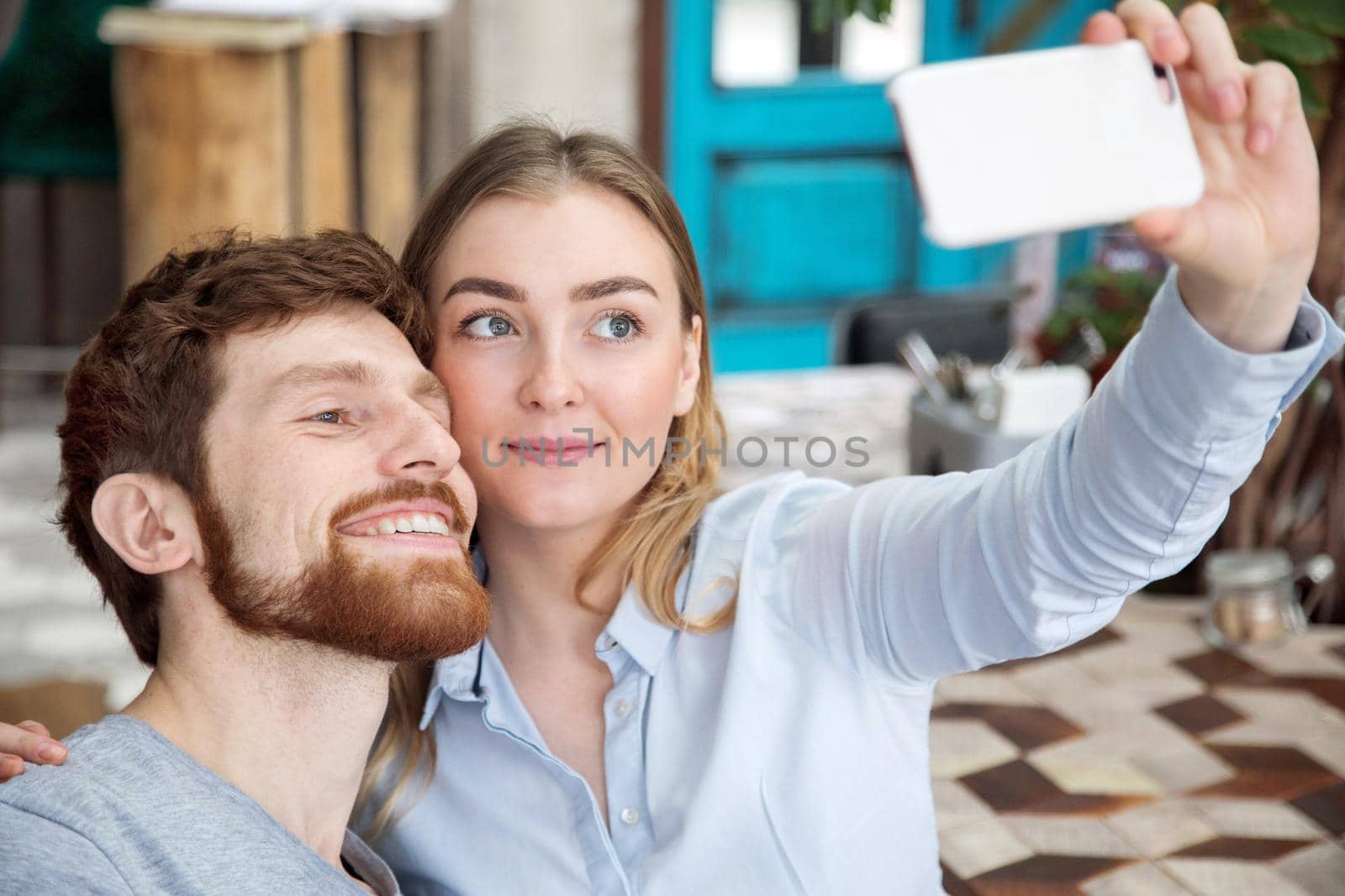 Young couple taking selfie by Demkat