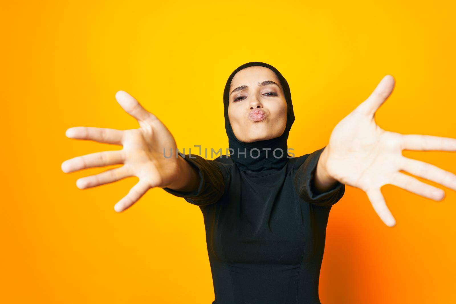 arab woman happiness fashion clothing hand gesture yellow background by Vichizh