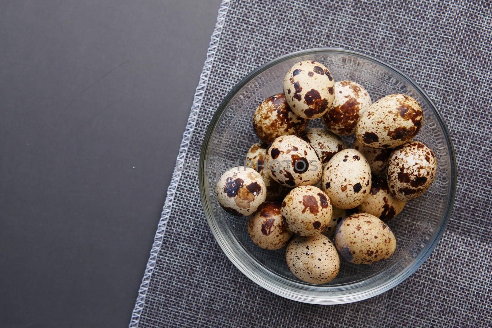close up of Quails eggs in a box .