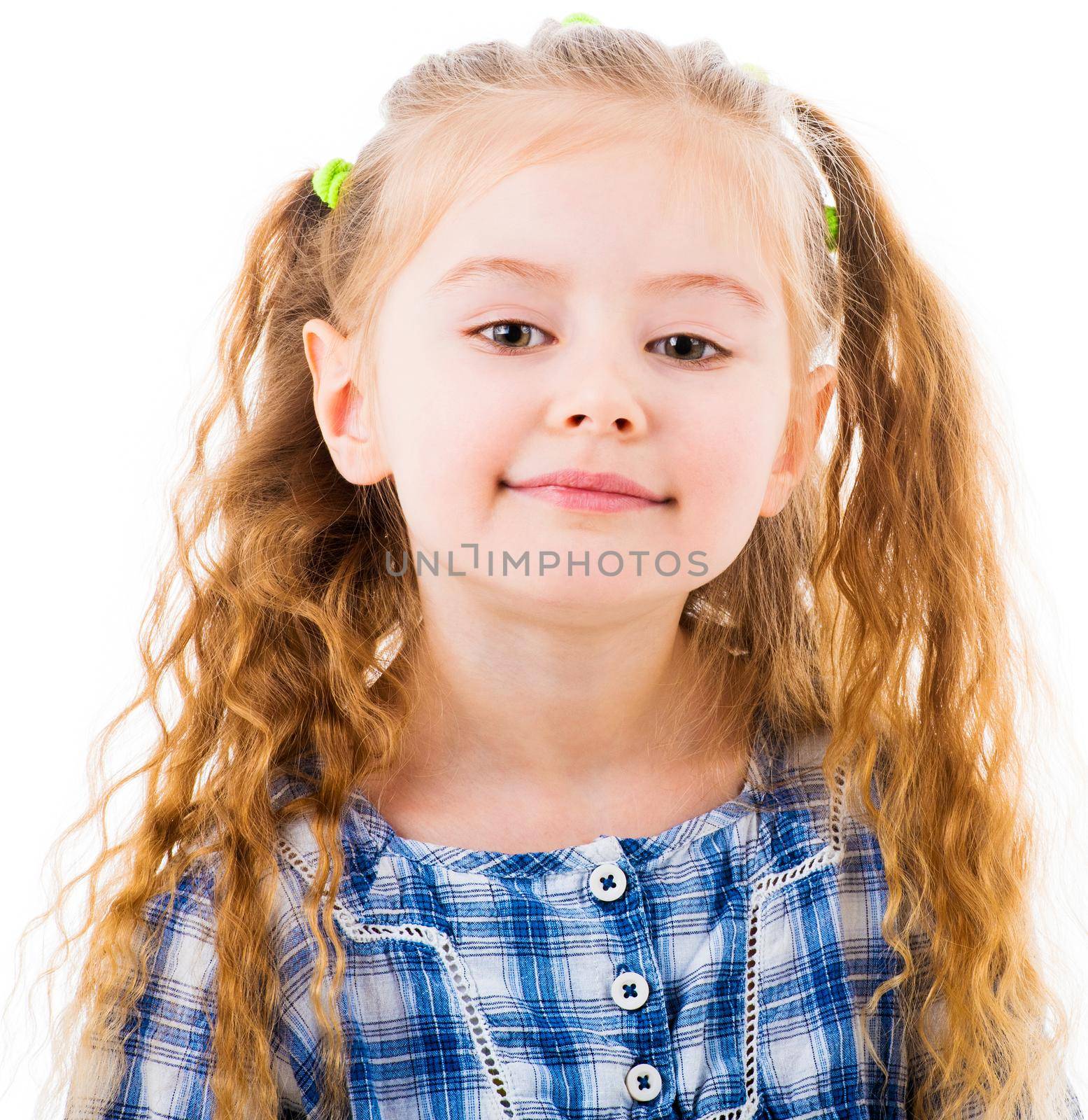 Portrait of cheerful baby girl with blonde wavy hairstyle in plaid blue blouse isolated on white background