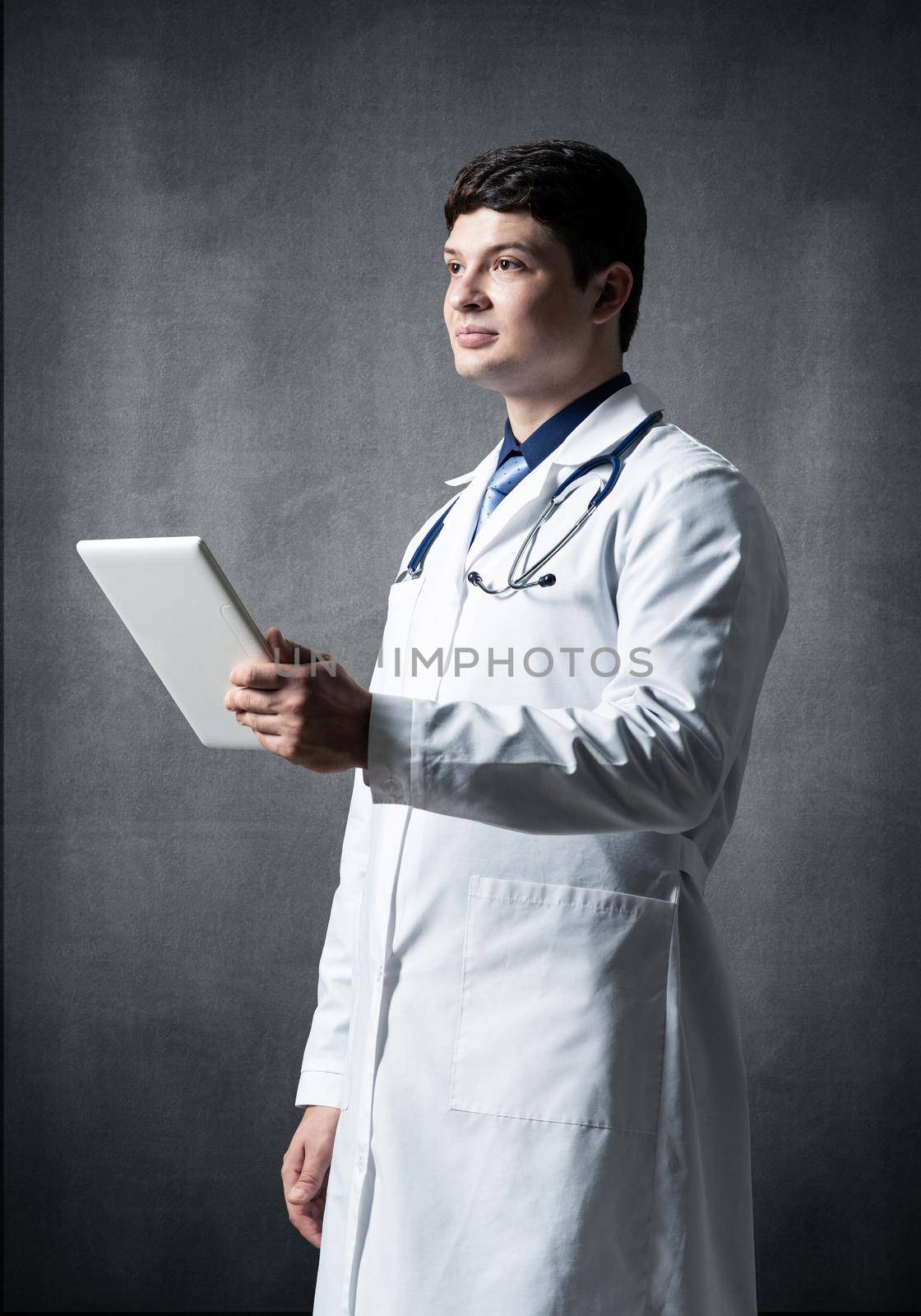 The doctor with the computer tablet. Digital technology in healthcare