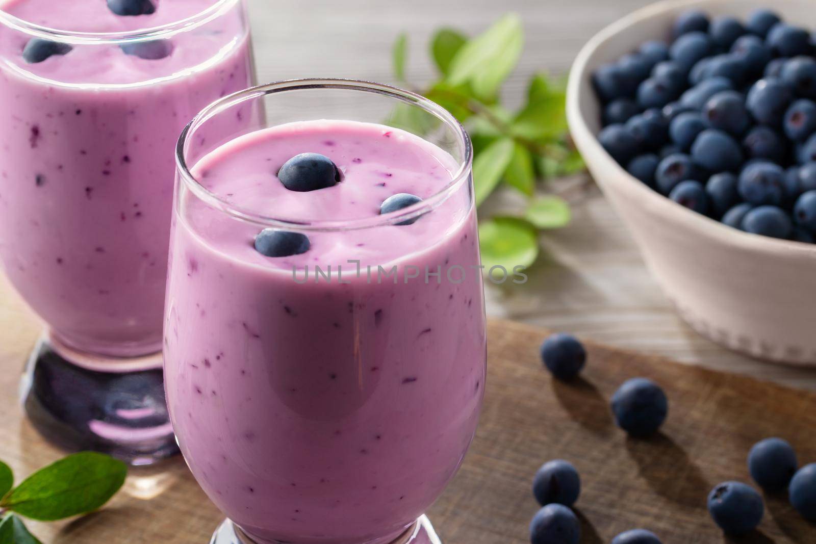 Homemade blueberry yogurt smoothie. Protein shake with berries.