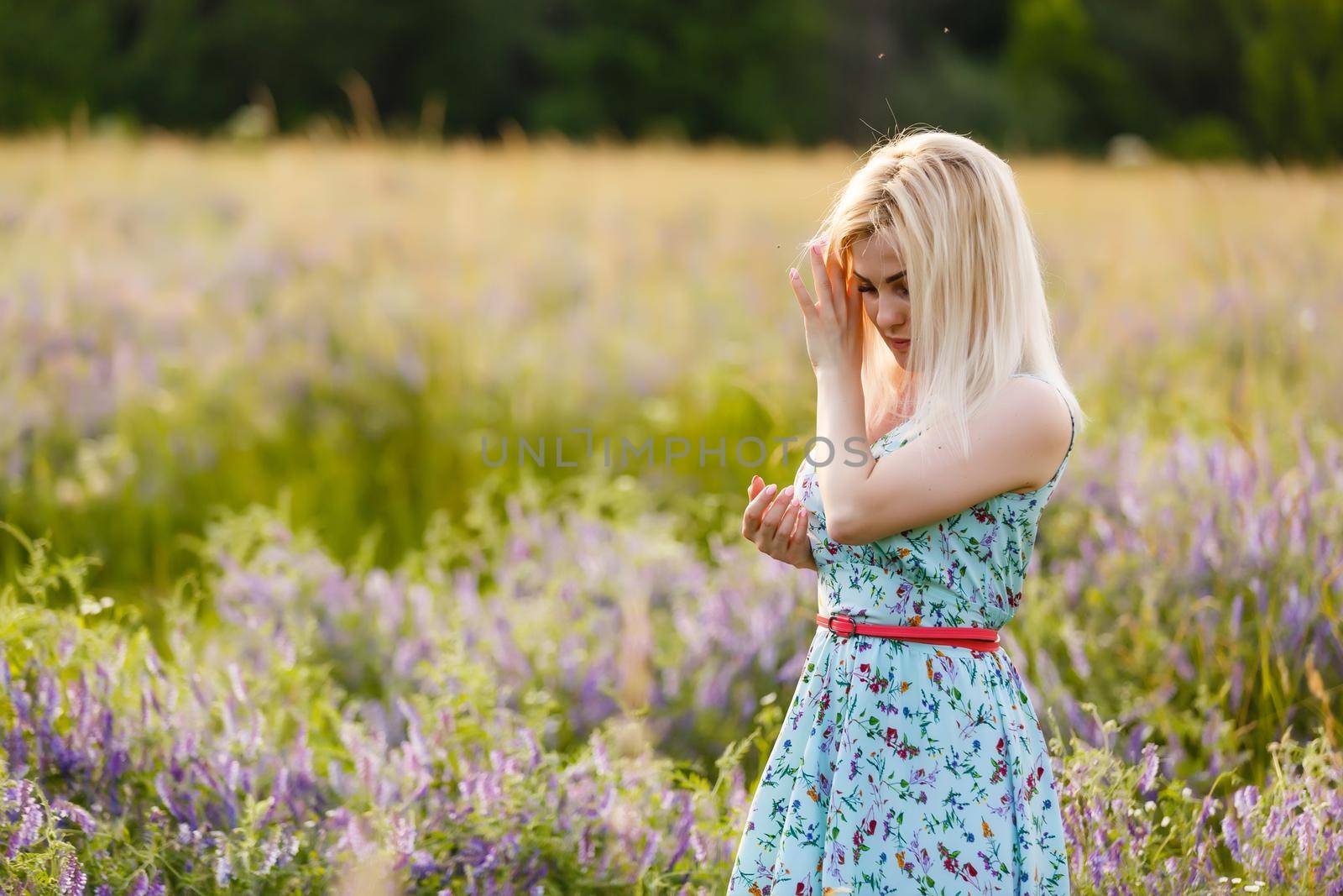 Bright Portrait of Happy Woman at Summer Field