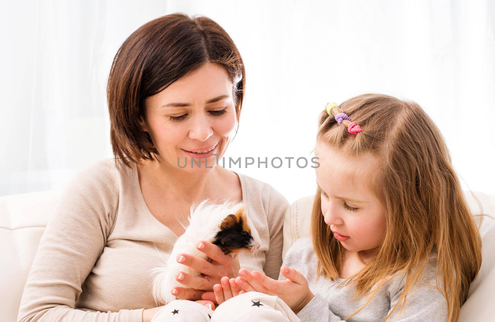 Mom and little girl playing with guinea pig by GekaSkr
