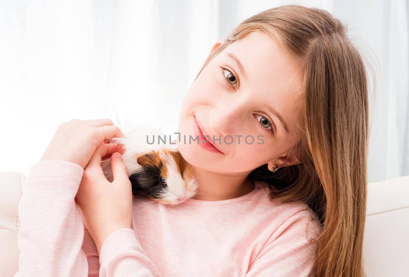 Charming little girl holding guinea pig by GekaSkr