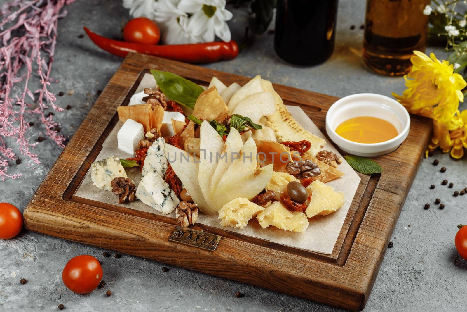 Palette of many types of cheese and some grapes, olives by UcheaD