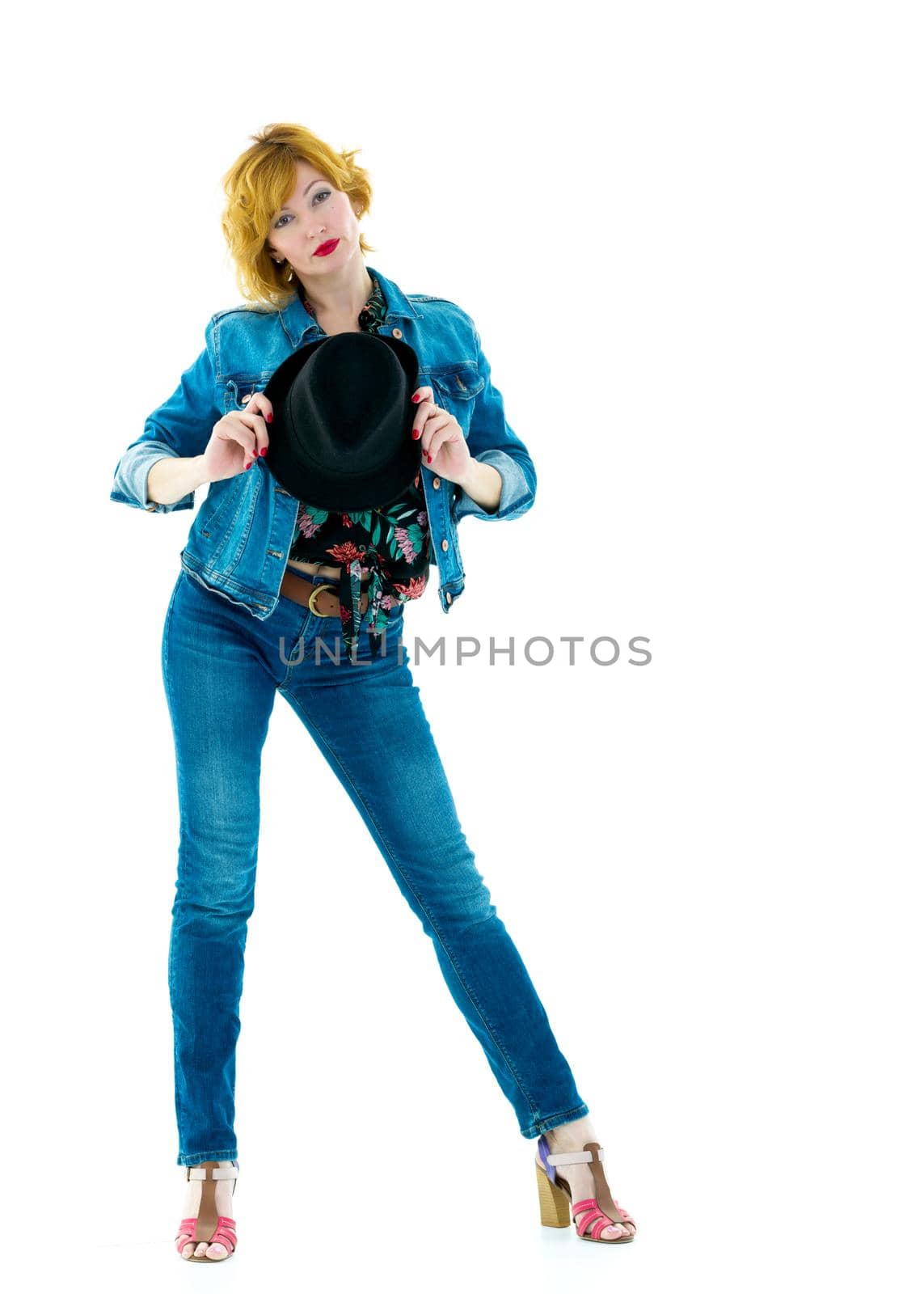 Beautiful young woman with a hat. Studio photo.Isolated on white background.