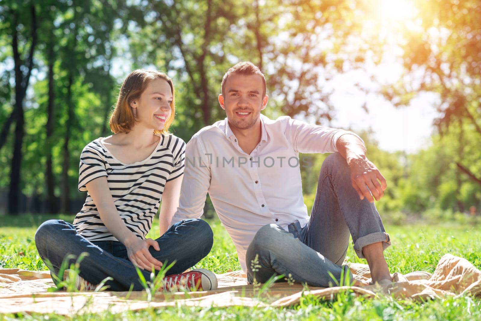 Couple on a picnic in the park by adam121