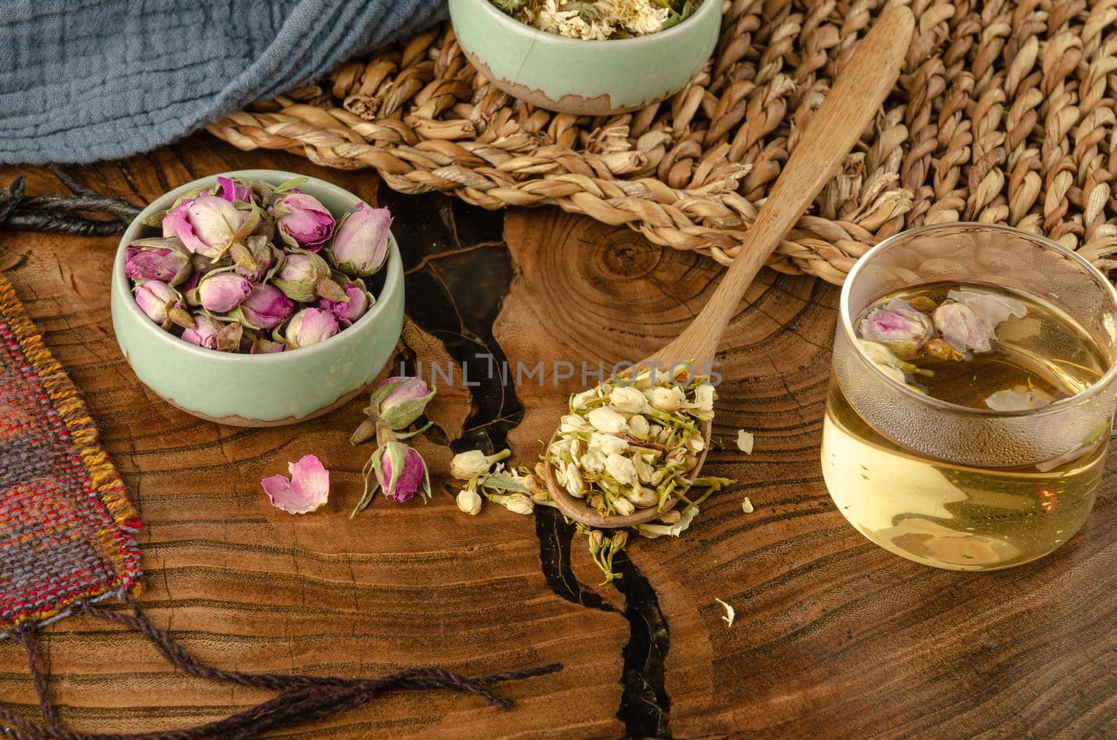 table with herbal tea and rose petals